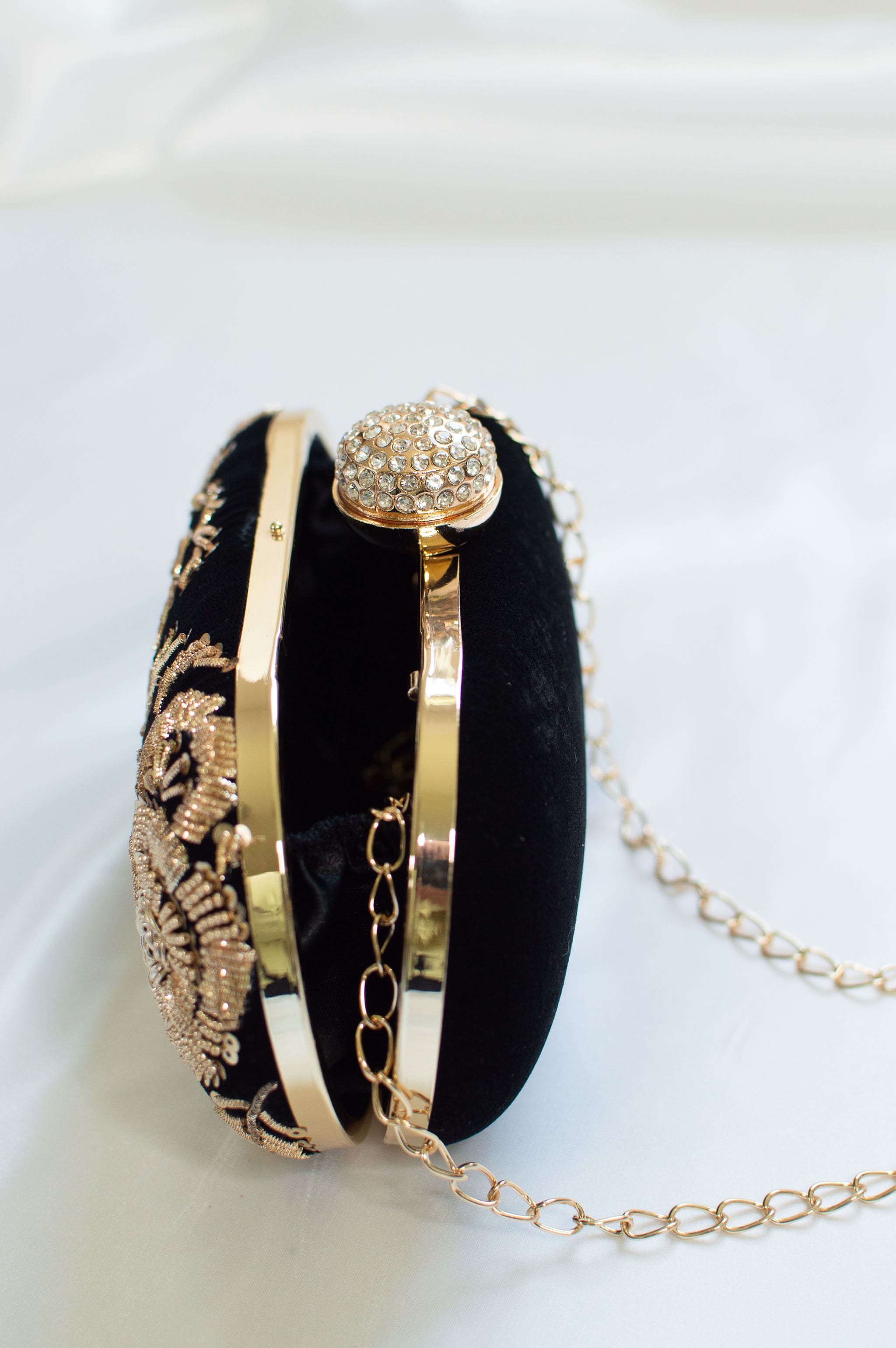 Black clutch with detachable chain straps