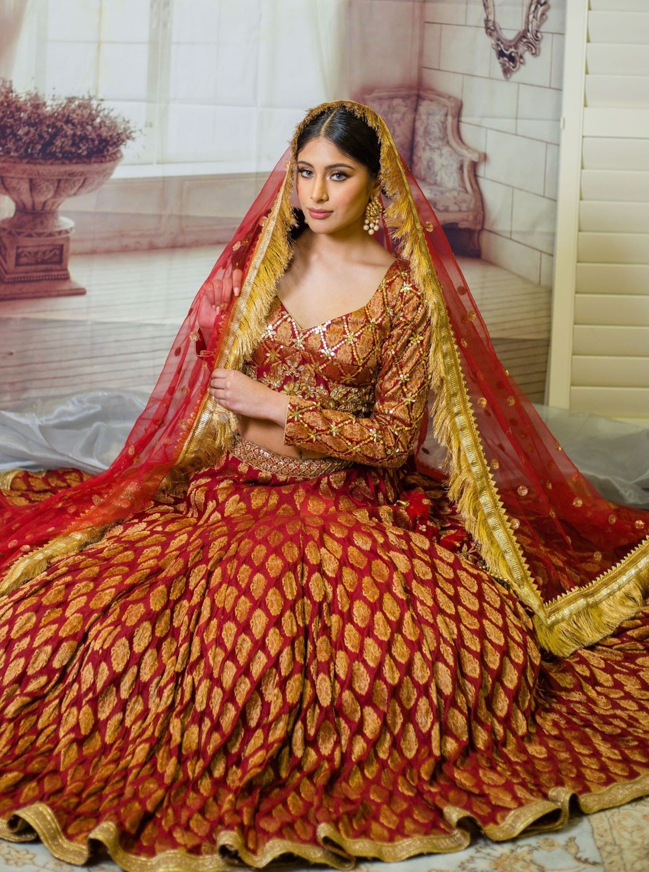 Maroon banarasi silk saree with golden belt