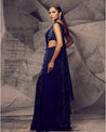 Draped in the rich hues of blue, this gown is a masterpiece of glamour and sophistication. 