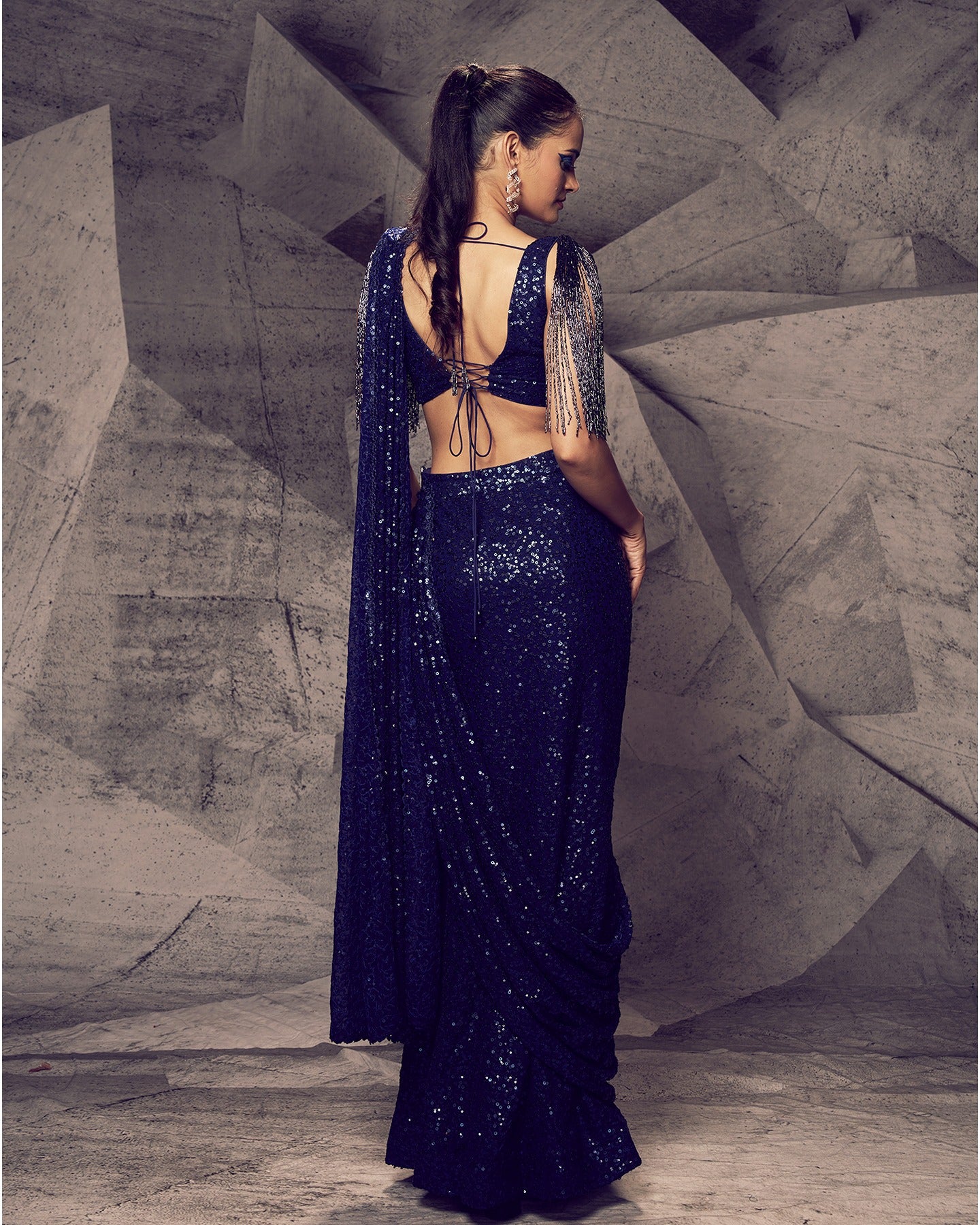 Draped in the enchanting allure of a slit saree, this ensemble redefines elegance with a contemporary twist.
