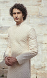 Regal beige and gold sherwani featuring delicate beadwork