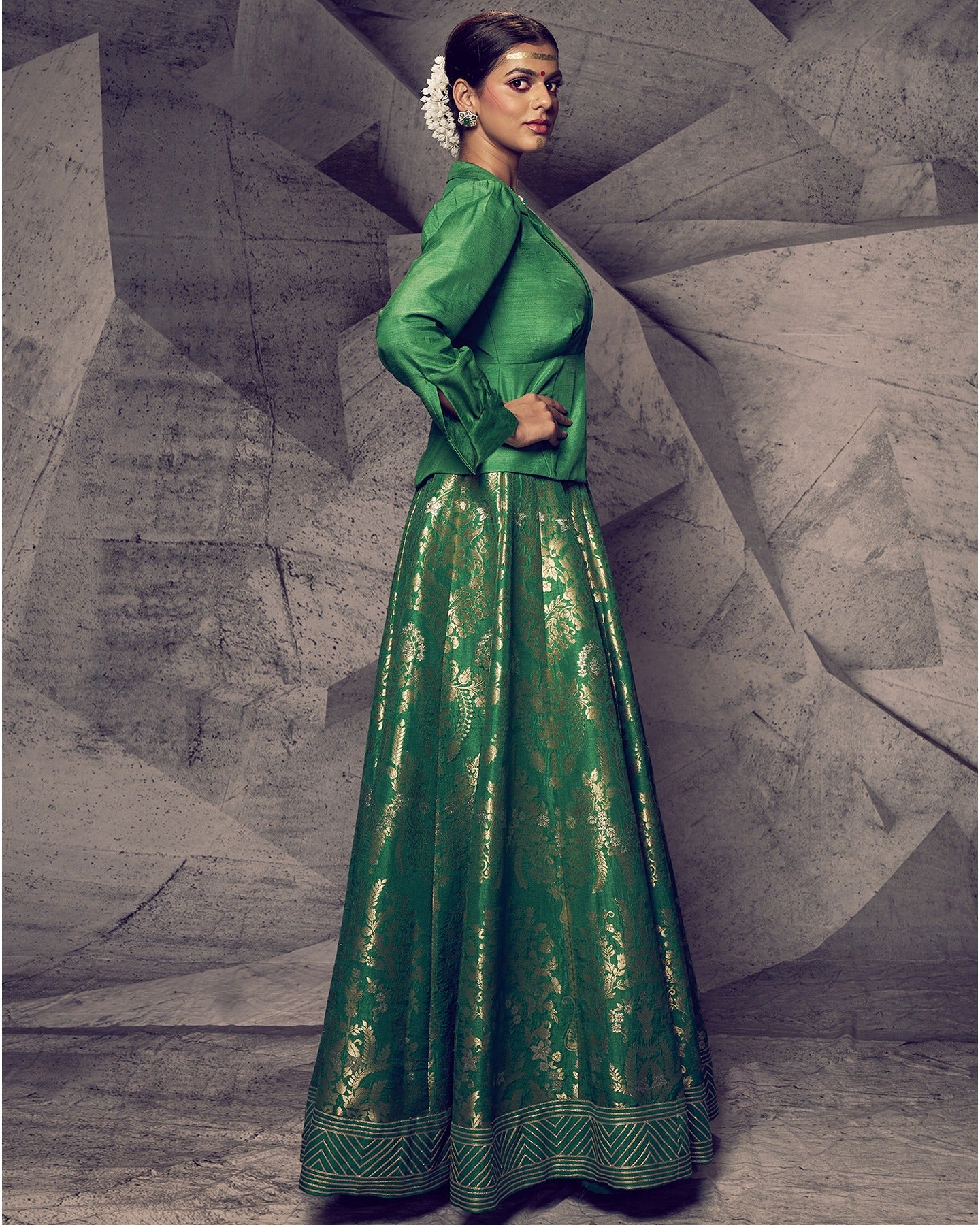 Radiating the freshness of nature, this green lehenga paired with a chic shirt is a modern ode to traditional elegance. 