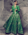 Radiating the freshness of nature, this green lehenga paired with a chic shirt is a modern ode to traditional elegance. 