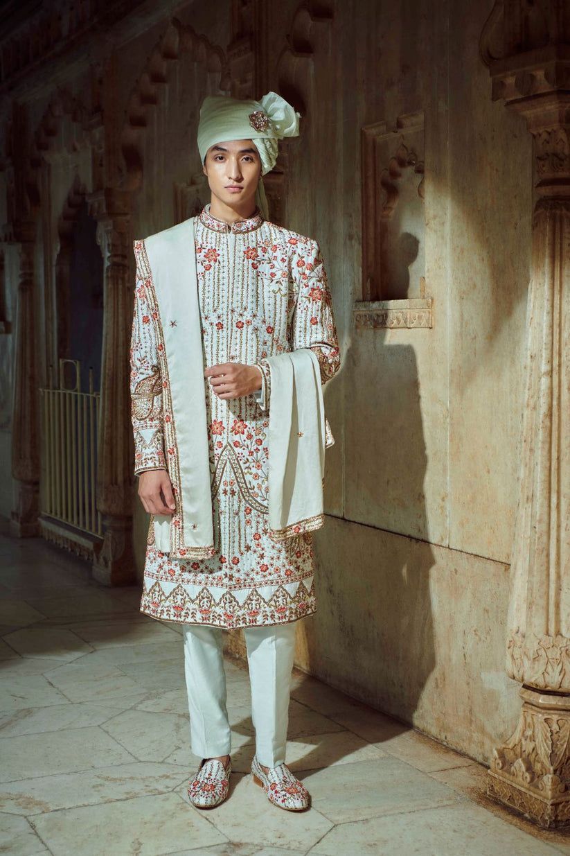 Make a statement in elegance with our Sherwani set, tailored to perfection. Crafted with Silk Sherwani, Linen Satin Kurta, and Pants, all customizable in mint green.