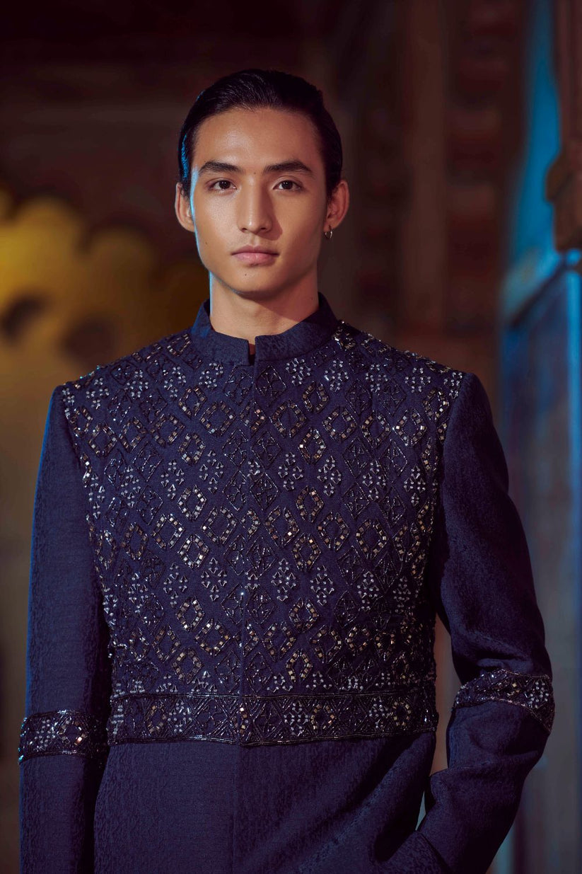 Stylish navy blue kurta jacket set adorned with traditional motifs