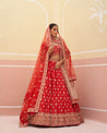 Vibrant red bridal lehenga crafted from raw silk