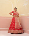 Regal red bridal lehenga in luxurious raw silk fabric