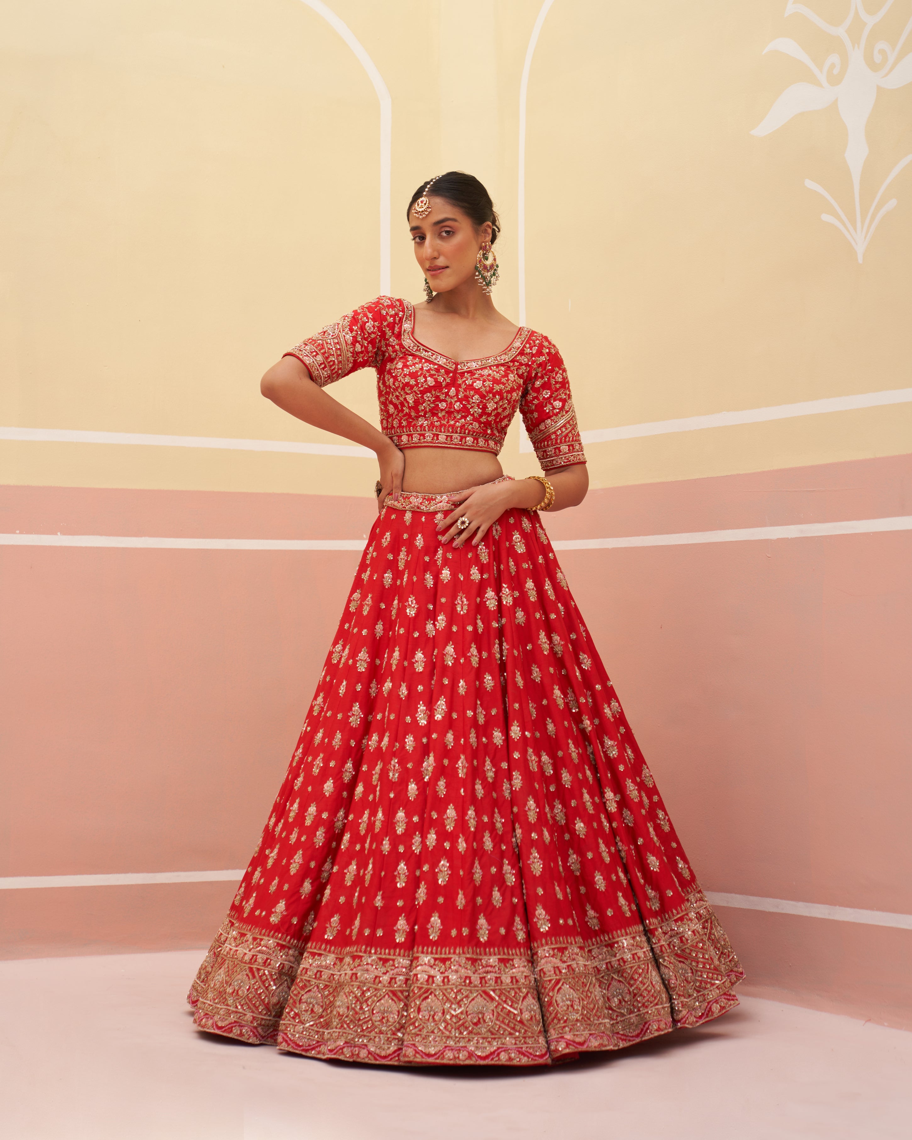 Traditional red silk bridal lehenga with a modern twis