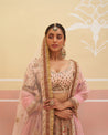 Graceful peach raw silk lehenga set adorned with floral motifs