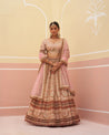 Sophisticated peach raw silk lehenga set with shimmering sequin details