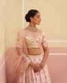 Regal pink raw silk lehenga set for a timeless bridal ensemble