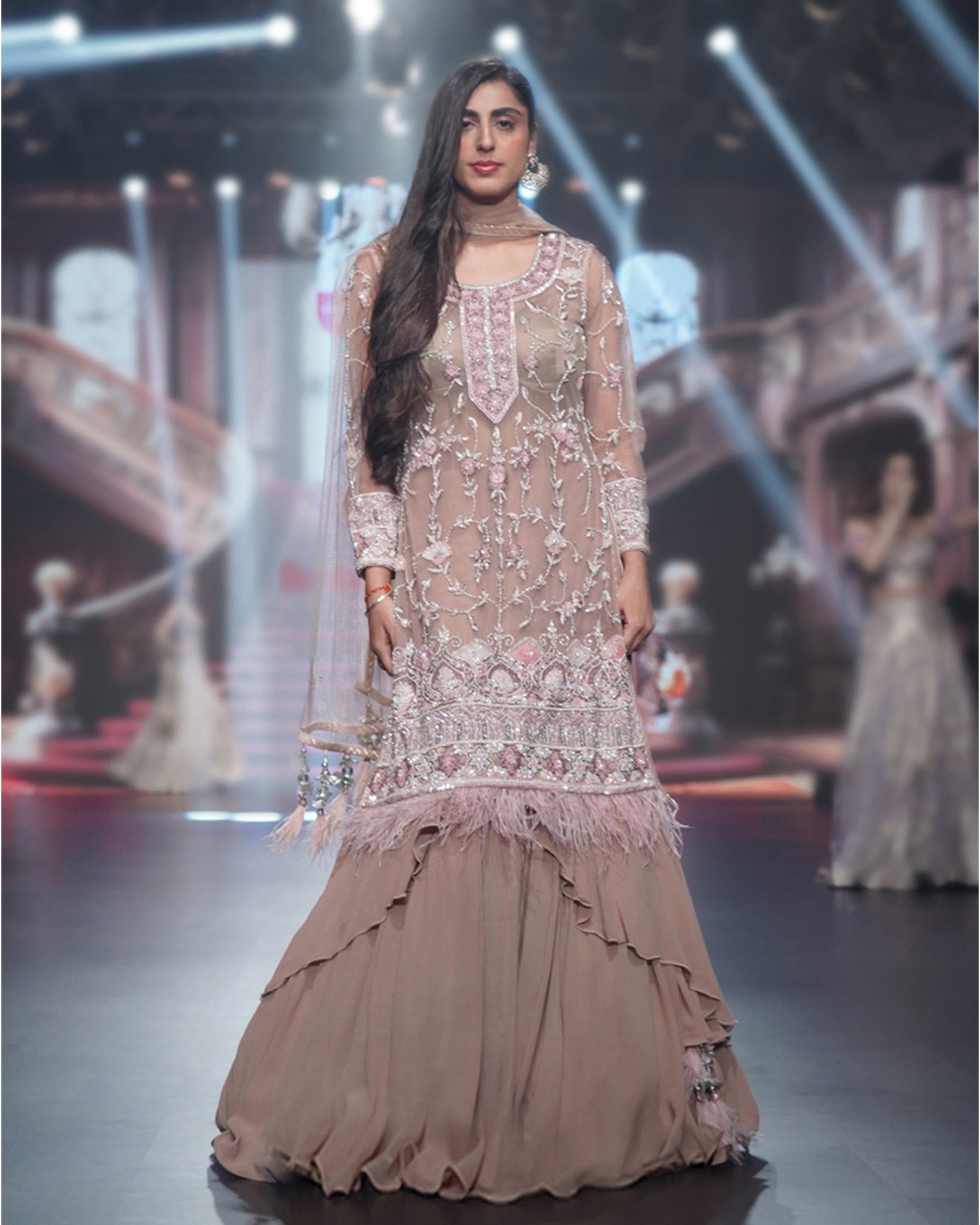 Draped in the rich ecru hue, this anarkali unfolds a story of elegance and intricate floral beauty.