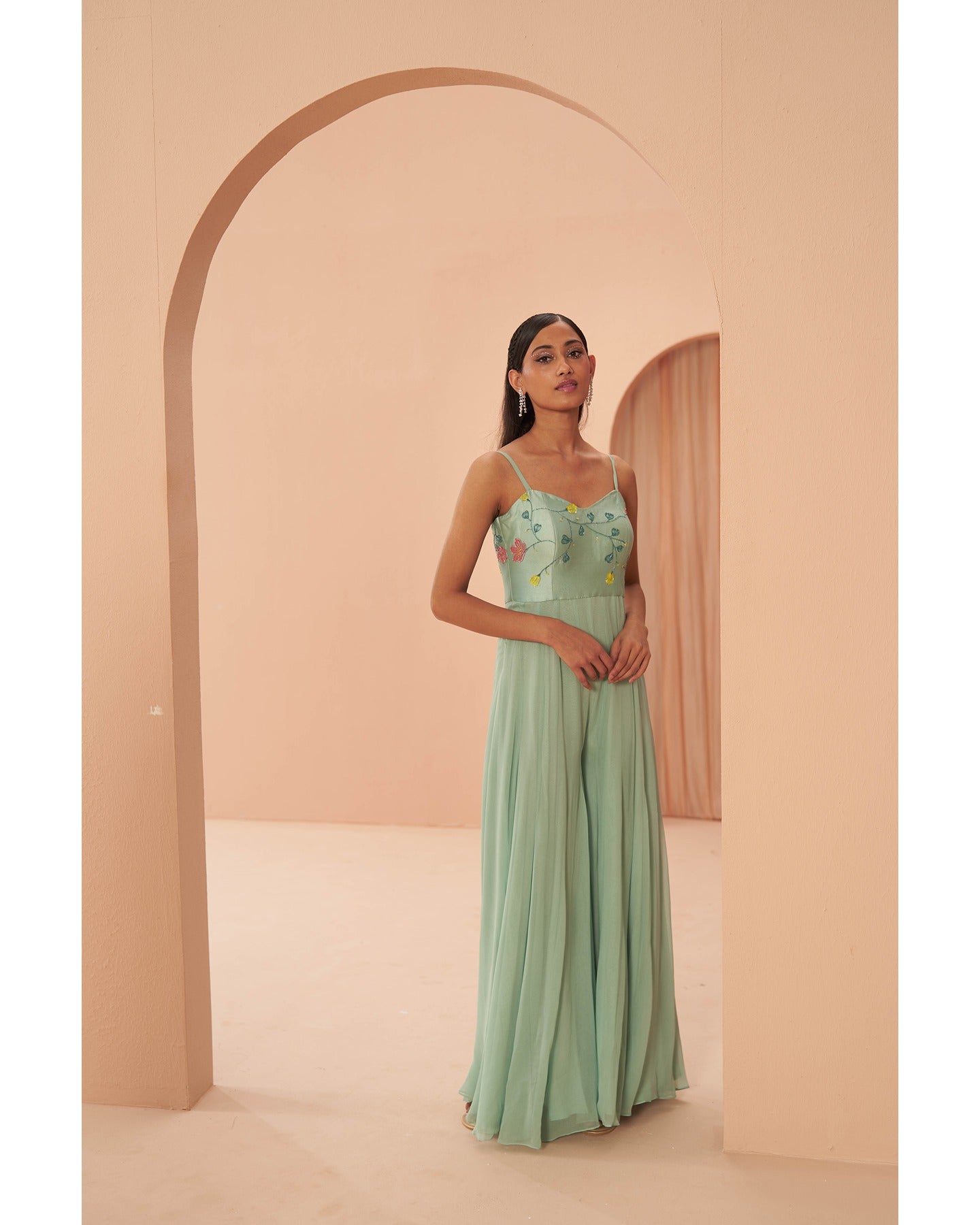 Green Glamour: Hand-embroidered sophistication steals the spotlight in this chic green jumpsuit.
