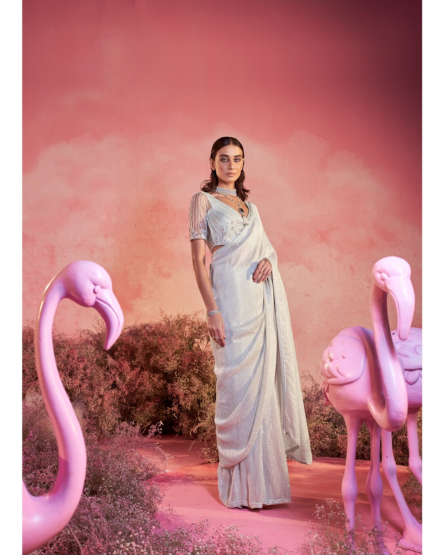 Whispers of Elegance: Embracing the artistry of hand-embroidery in this pristine white saree set. 