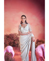 Whispers of Elegance: Embracing the artistry of hand-embroidery in this pristine white saree set. 