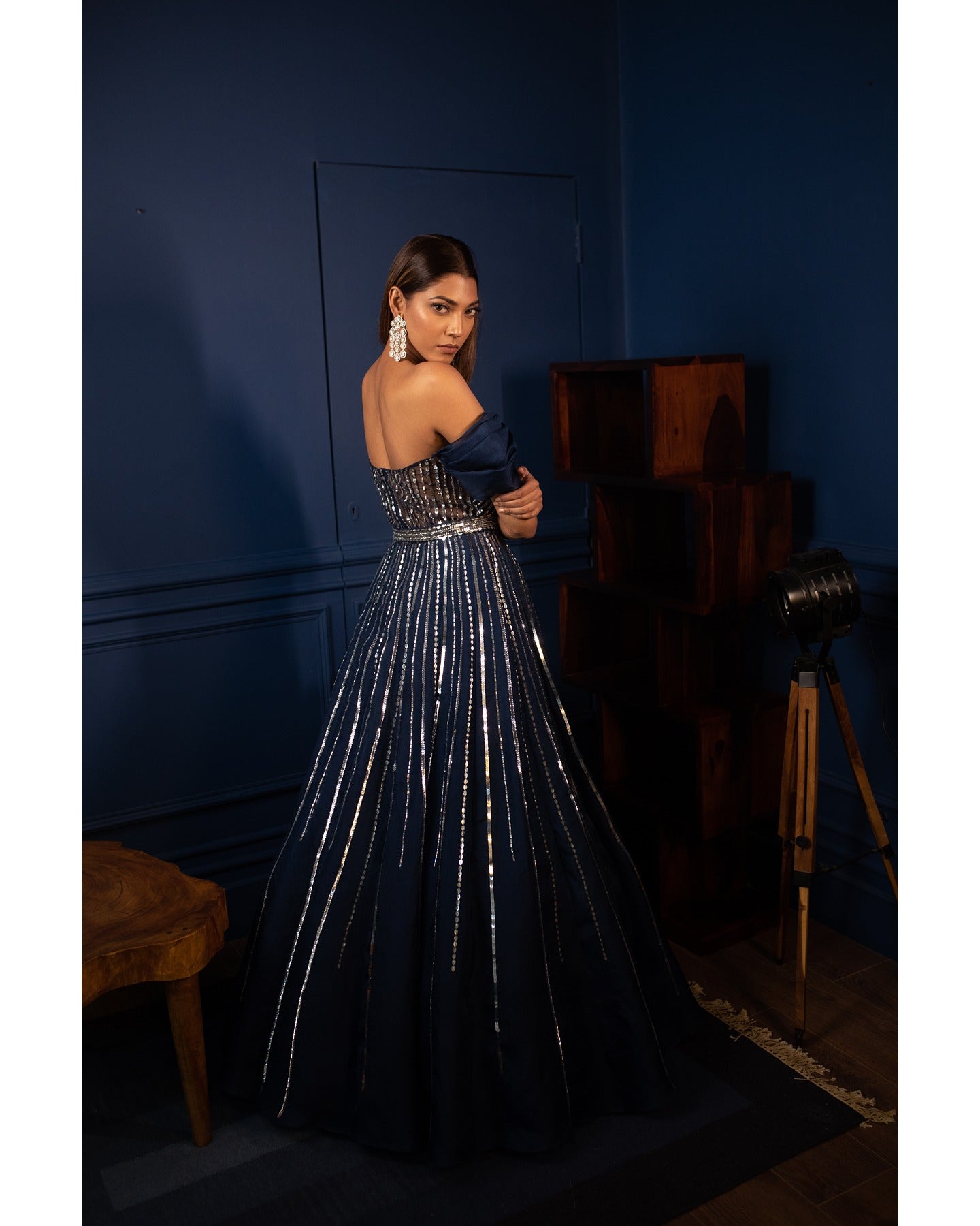 Draped in the enchanting depths of midnight blue, this gown is a celestial masterpiece.