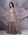 Elegance in every fold: Adorned in a graceful grey sharara set, where traditional charm meets contemporary style.