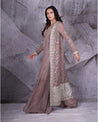 Draped in the sophistication of grey, this jacket sharara set blooms with shimmering floral silver embroidery.