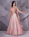 Draped in the romantic hues of pink, this bridal lehenga is a symphony of love and grace.