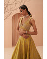 Sunny Splendor: Hand-embroidered grace on a radiant yellow lehenga, a canvas of timeless elegance.