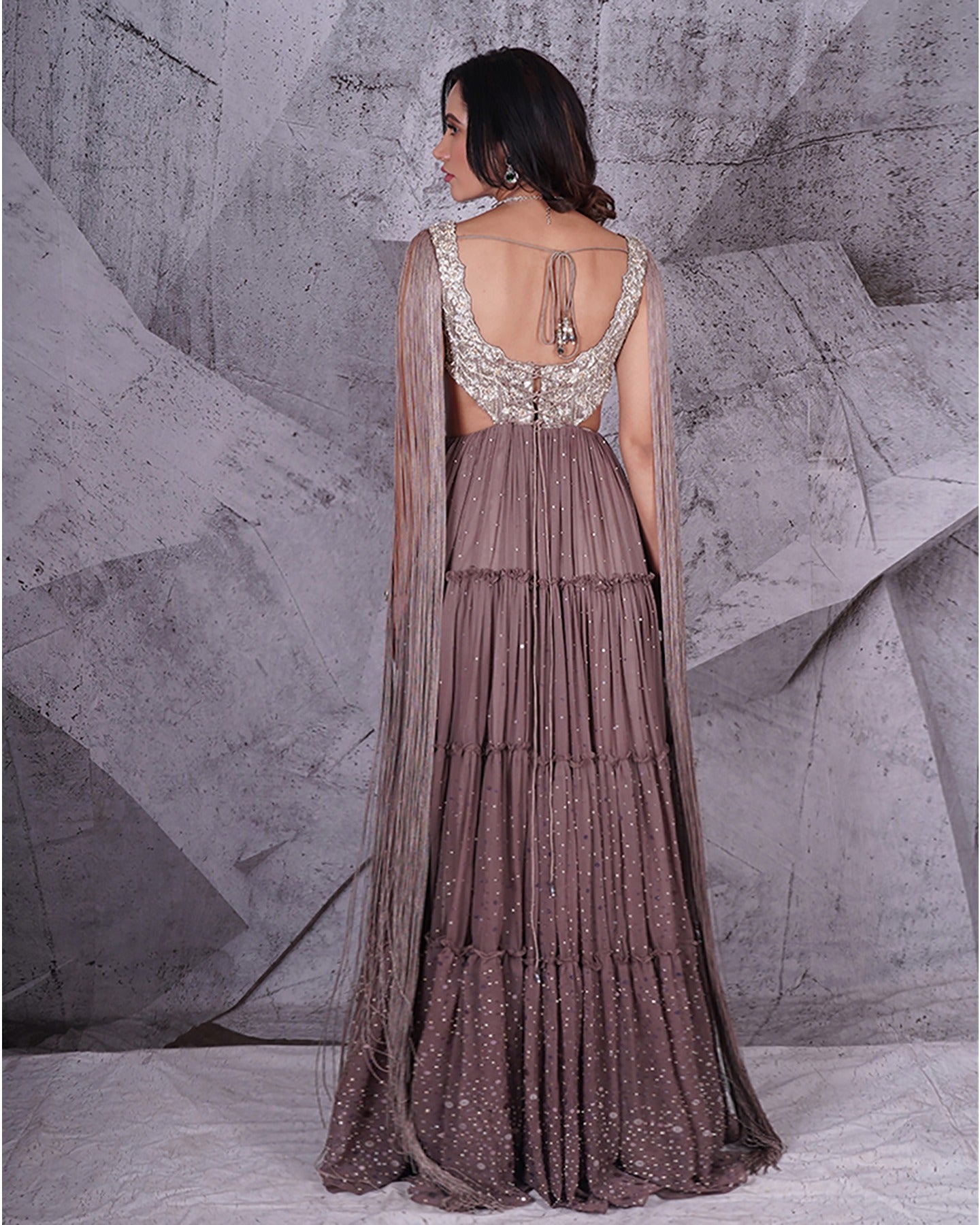 Draped in the timeless allure of grey, this anarkali whispers tales of elegance with every sway. 