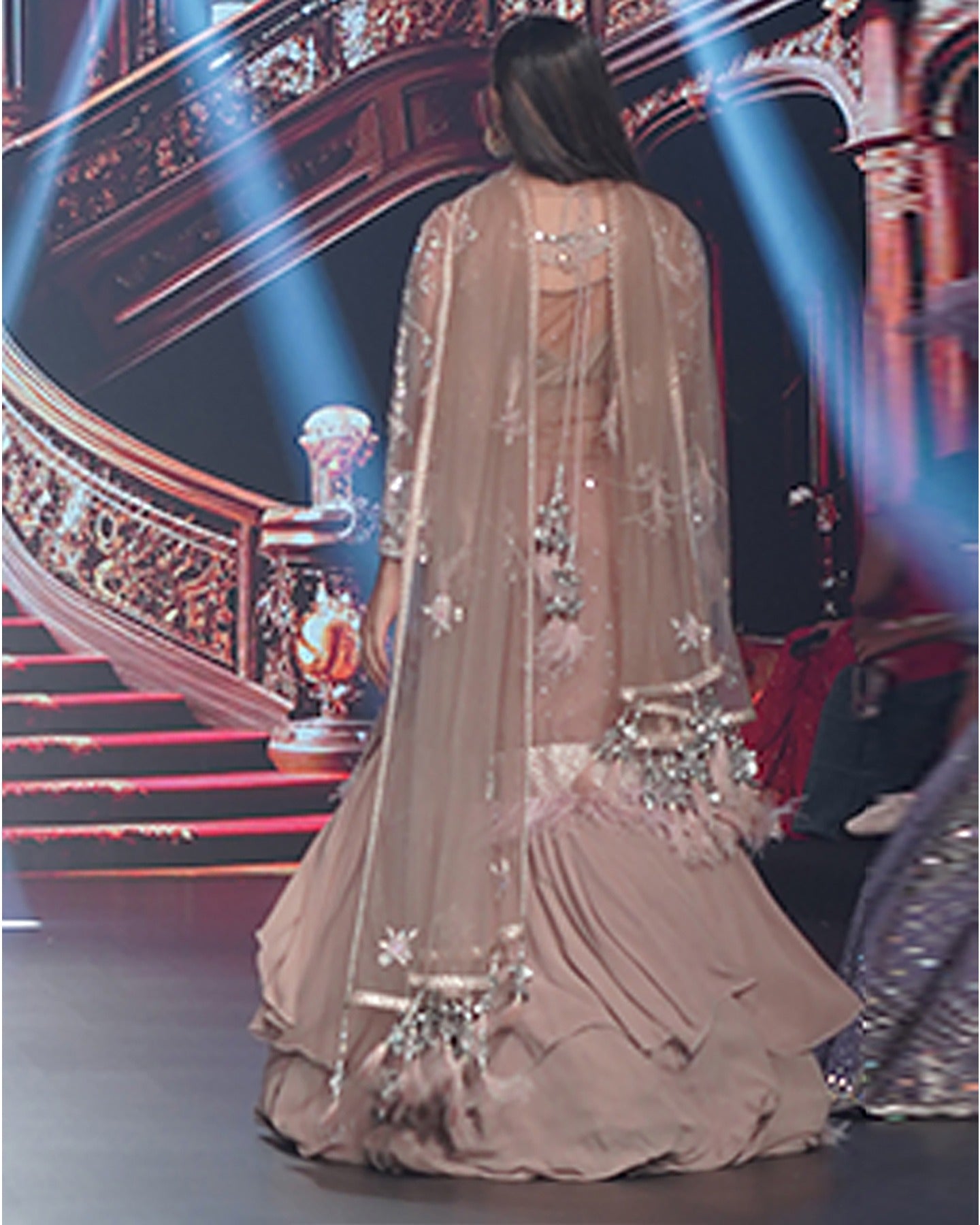 Draped in the rich ecru hue, this anarkali unfolds a story of elegance and intricate floral beauty.