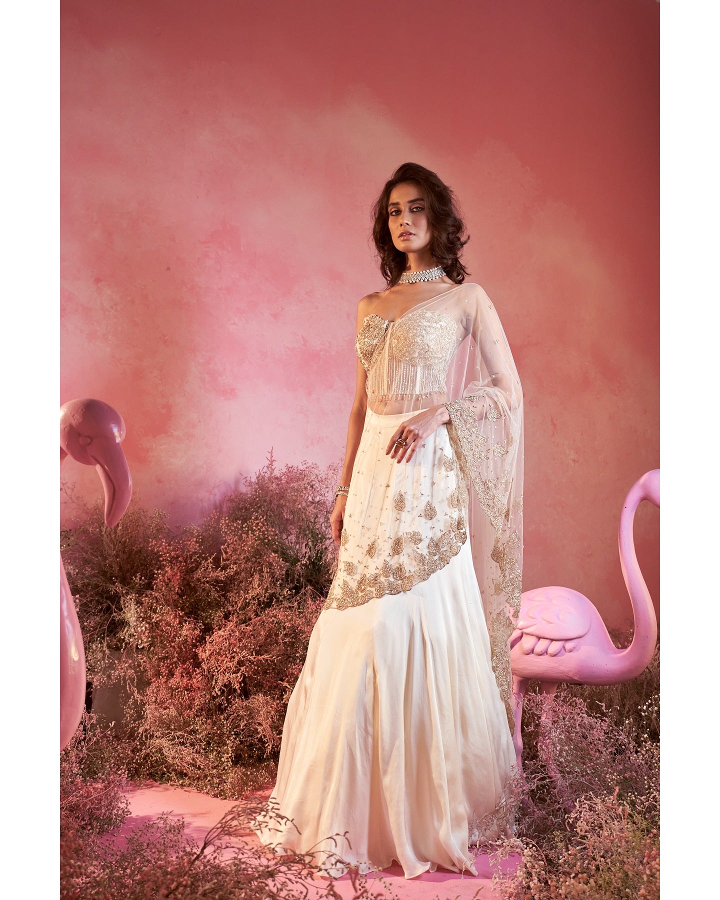 Timeless Beauty in Off-White: Hand-embroidered details elevate this drape saree, weaving a tale of elegance and sophistication.