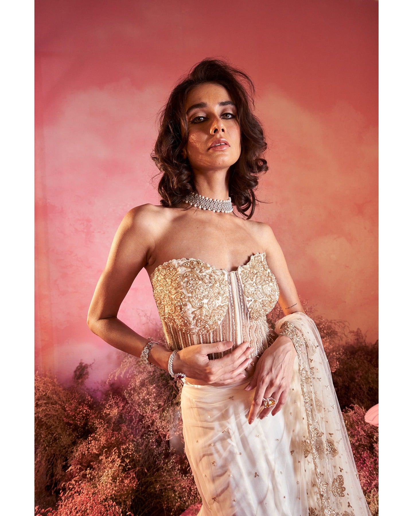 Timeless Beauty in Off-White: Hand-embroidered details elevate this drape saree, weaving a tale of elegance and sophistication.