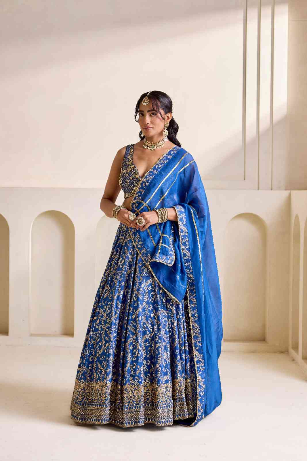 Deep blue embroidered blouse and Brocade lehenga set