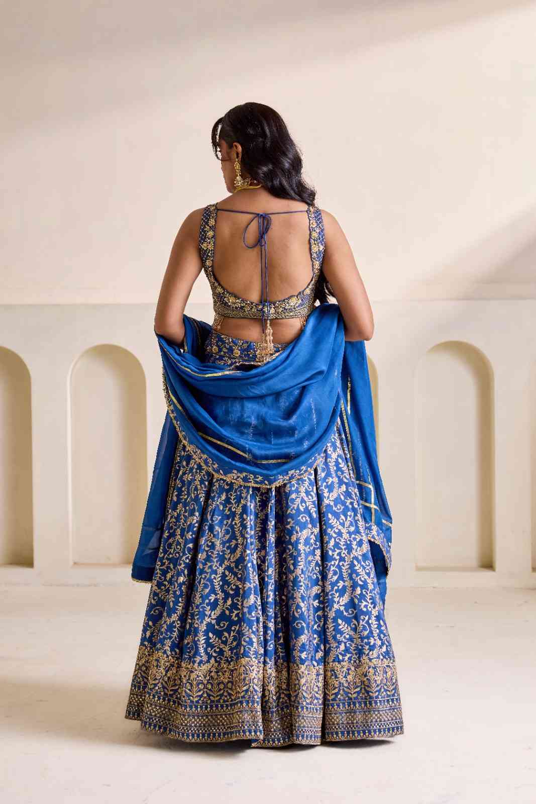 Deep blue embroidered blouse and Brocade lehenga set