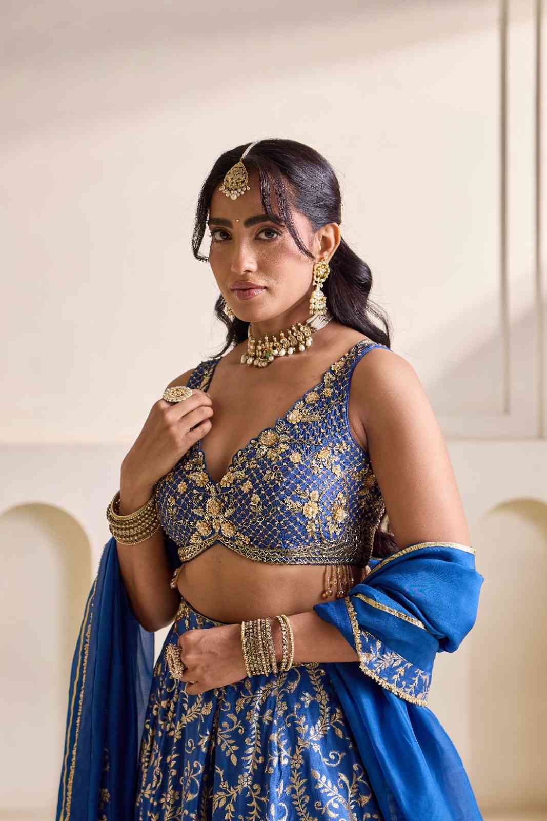 Deep blue embroidered blouse and Brocade lehenga set