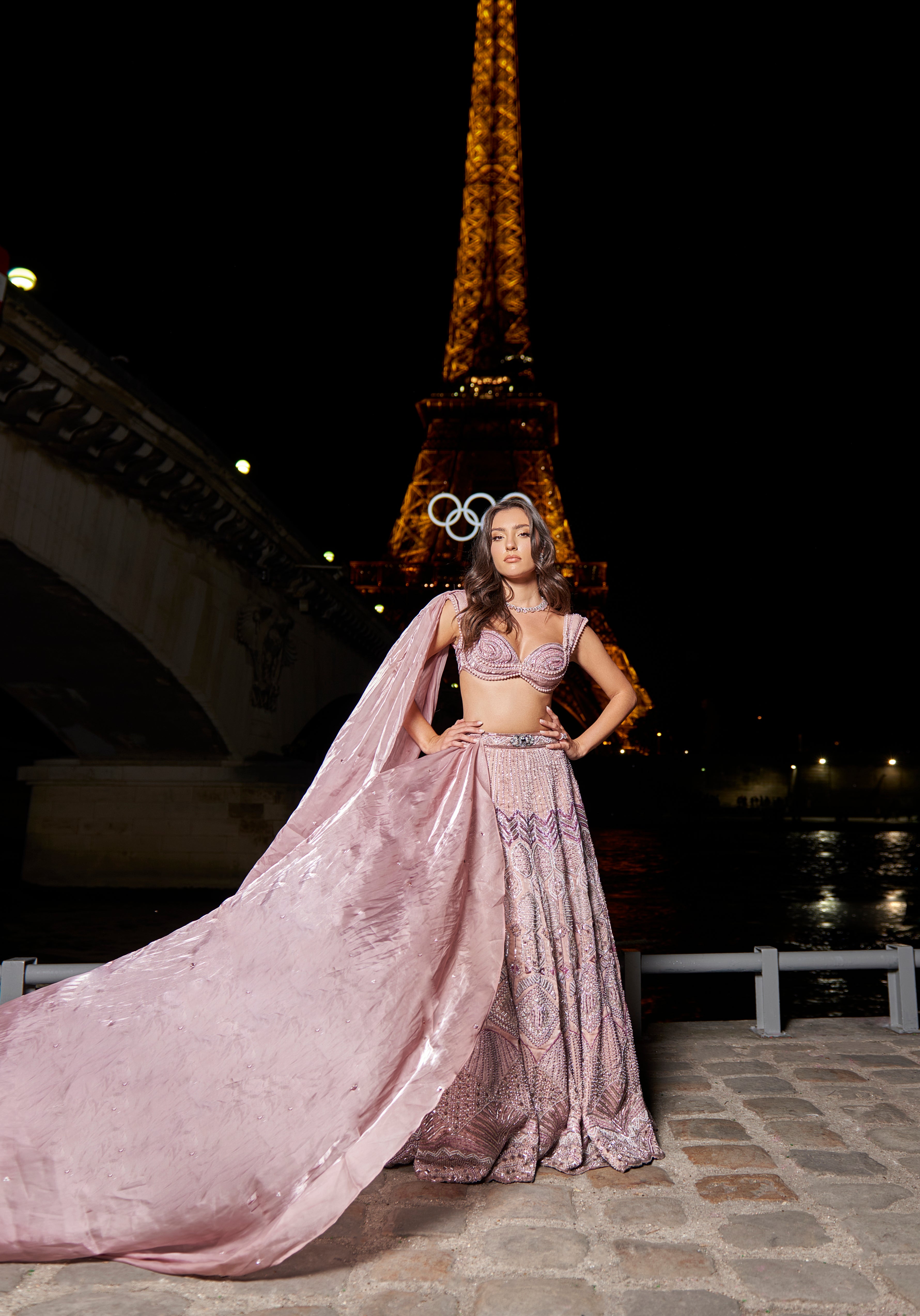 Elegant rose nude pink lehenga set, adorned with detailed embroidery on linen satin. Paired with a linen satin blouse showcasing intricate fabric manipulation and a soft organza dupatta