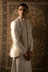 Unleash your inner sophistication: Embrace the allure of Ivory with this Rawsilk Jacket, Silk Kurta, and Linen Satin Pants ensemble, a symbol of timeless elegance.