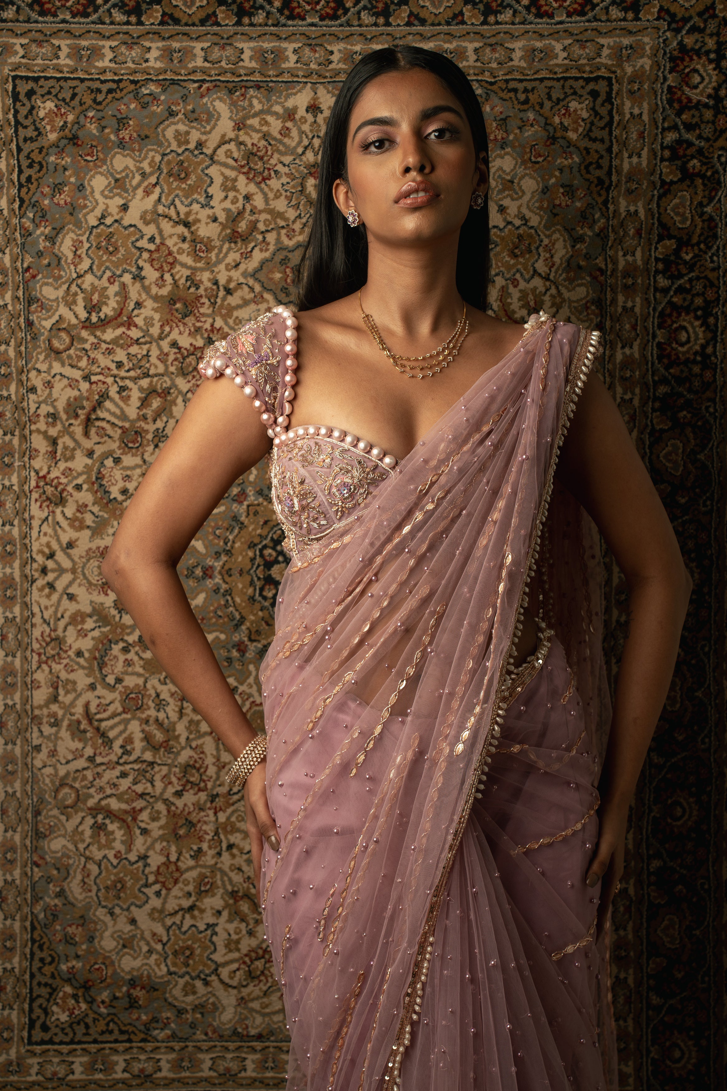 Indulge in luxury: Lilac Net Saree adorned with a Velvet and Net blouse, a mesmerizing ensemble for the modern woman.