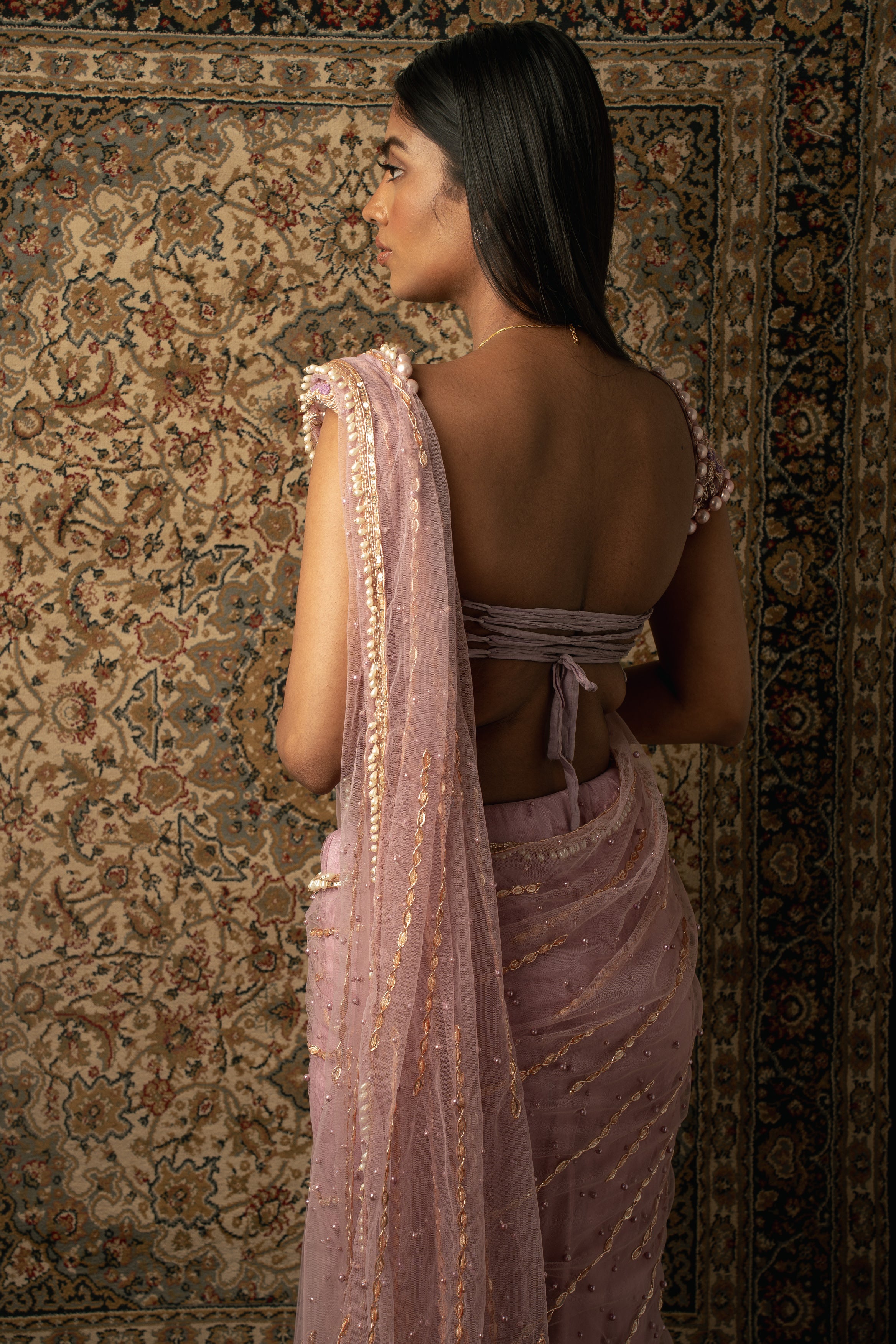 Lilac dreams come true: Net Saree paired with a Velvet and Net blouse, a graceful ode to femininity and sophistication.