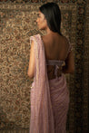 Lilac dreams come true: Net Saree paired with a Velvet and Net blouse, a graceful ode to femininity and sophistication.