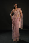 Enchanting in Lilac: Drift into elegance with this Net Saree, Velvet and Net blouse ensemble, a fusion of grace and allure.