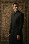 Command attention with this sleek Black Silk Sherwani, Spandex Kurta, and Pants ensemble, marrying classic style with urban chic.