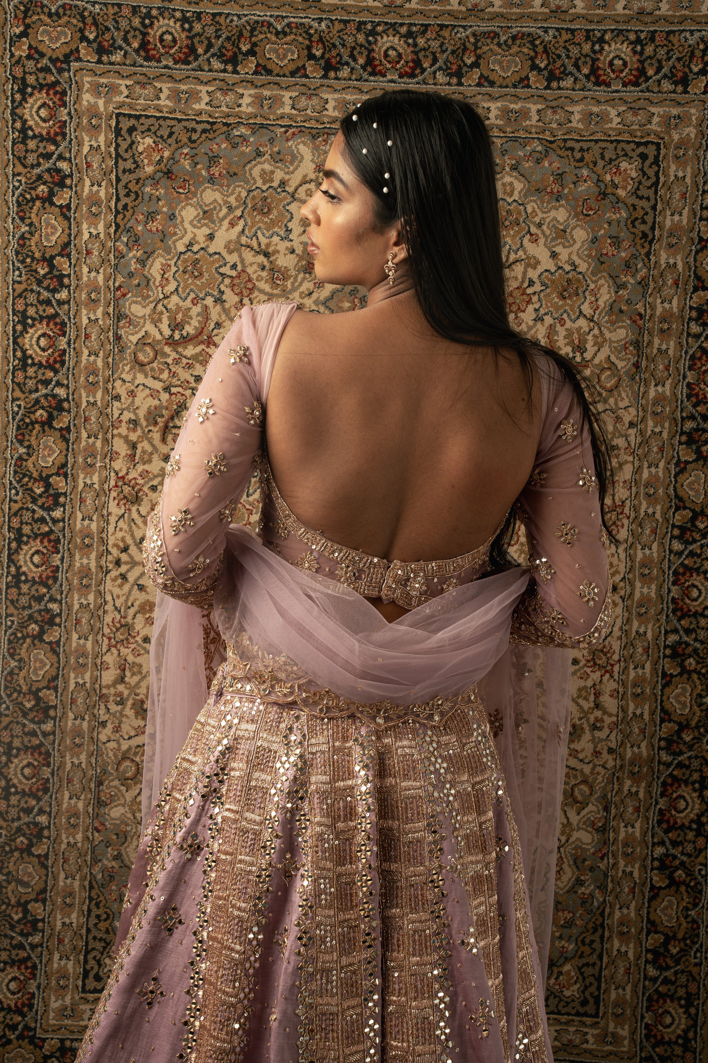 Lilac dreams: Drift into enchantment with this Linen Satin Lehenga, Net blouse, and Dupatta ensemble, a perfect blend of tradition and modernity.