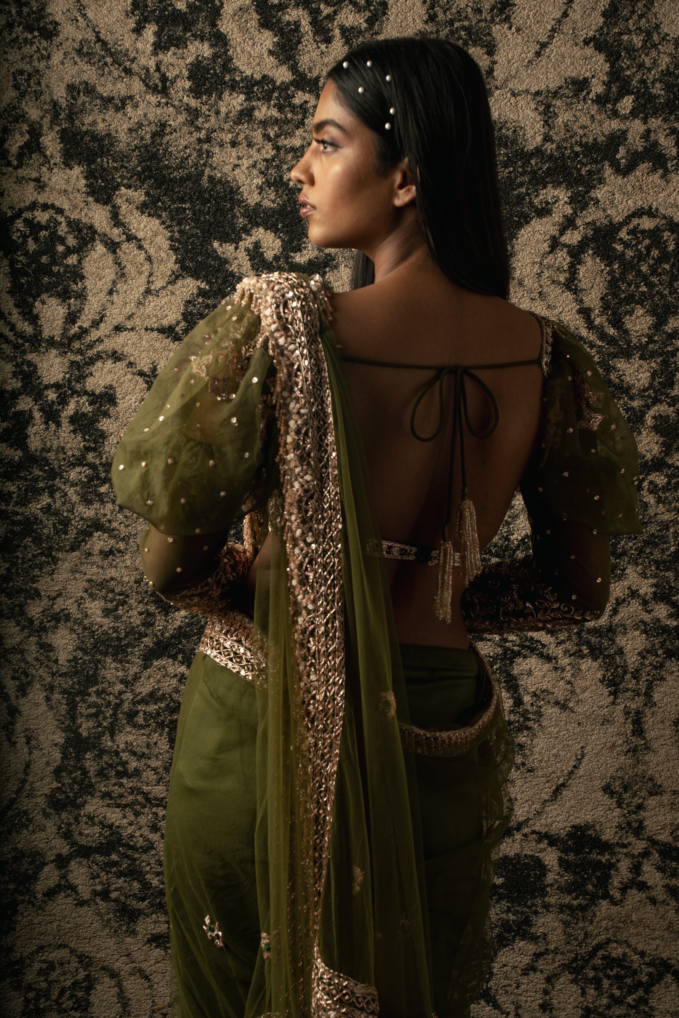 Indulge in opulence: Olive Green Net Saree adorned with a lavish Velvet and Organza blouse, a perfect blend of tradition and contemporary flair.