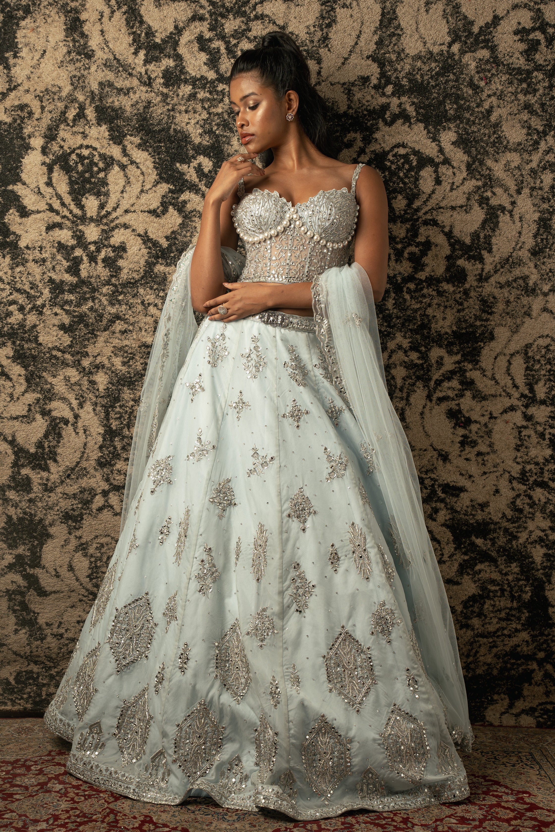 Enchanting in Stellar Blue: Organza Lehenga with Net blouse and Dupatta, a timeless ensemble that captures the essence of celestial charm