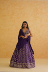 A sophisticated purple brocade lehenga set that exudes elegance and style, perfect for any special occasion.