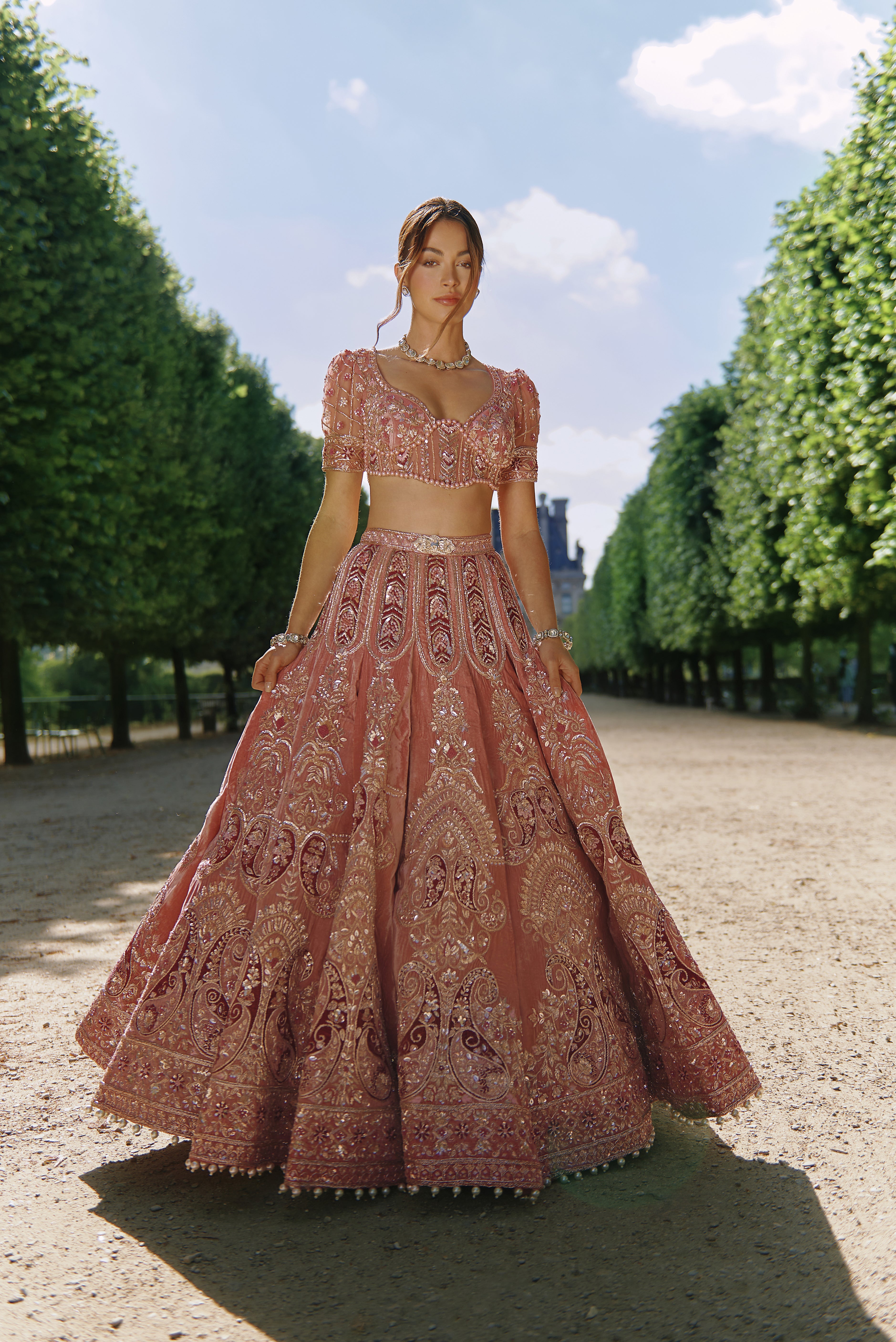 Mauve velvet lehenga set with exquisite handcrafted embroidery. The luxurious velvet lehenga and blouse are complemented by a delicate net dupatta, adding an ethereal touch to this elegant ensemble