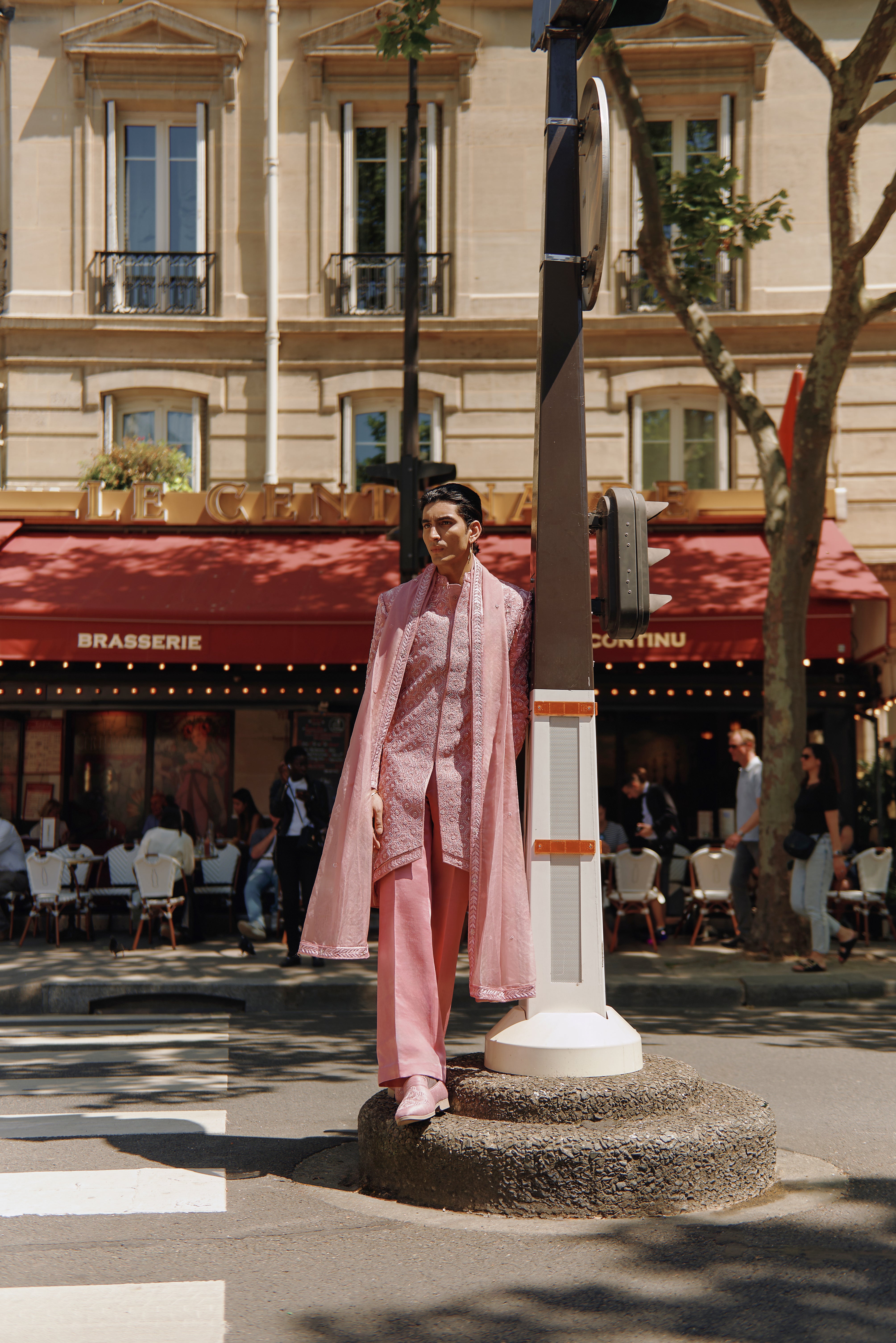 Pink raw silk sherwani set, adorned with hand crystal work embroidery. Includes a linen silk kurta and pant, along with a soft organza dupatta, offering a refined and regal appearance