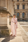 Elegant blush pink sherwani set, featuring detailed hand embroidery on raw silk. The ensemble includes a Chanderi silk kurta, pant, and a matching dupatta for a refined and timeless look