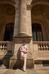 Blush pink sherwani set with intricate hand embroidery, crafted from luxurious raw silk. Paired with a Chanderi silk kurta, pant, and matching dupatta, this ensemble exudes sophistication and timeless elegance