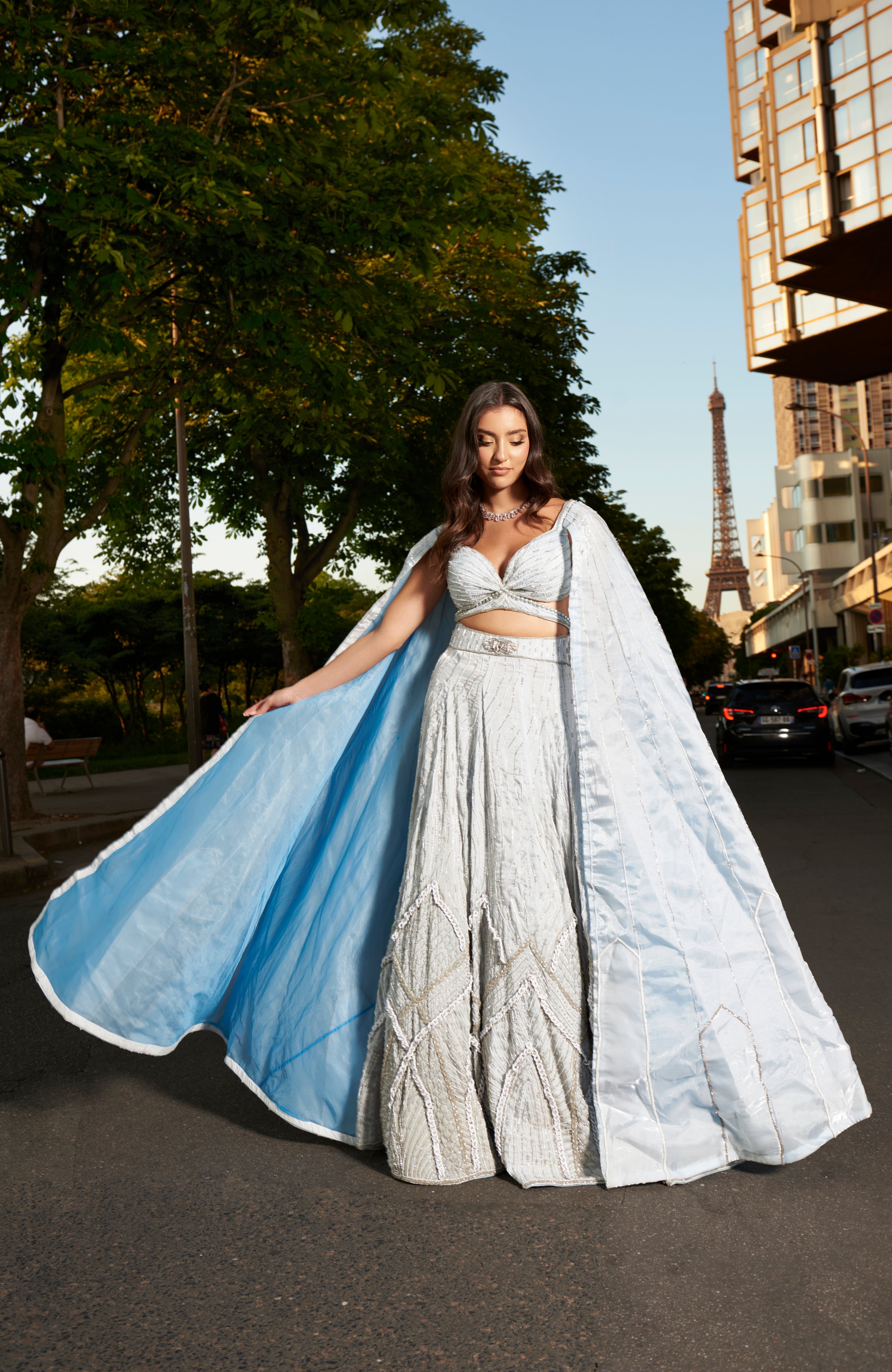 Elegant ice blue lehenga set, meticulously handcrafted with detailed embroidery. Includes a trail organza dupatta that adds a modern touch to this sophisticated outfit