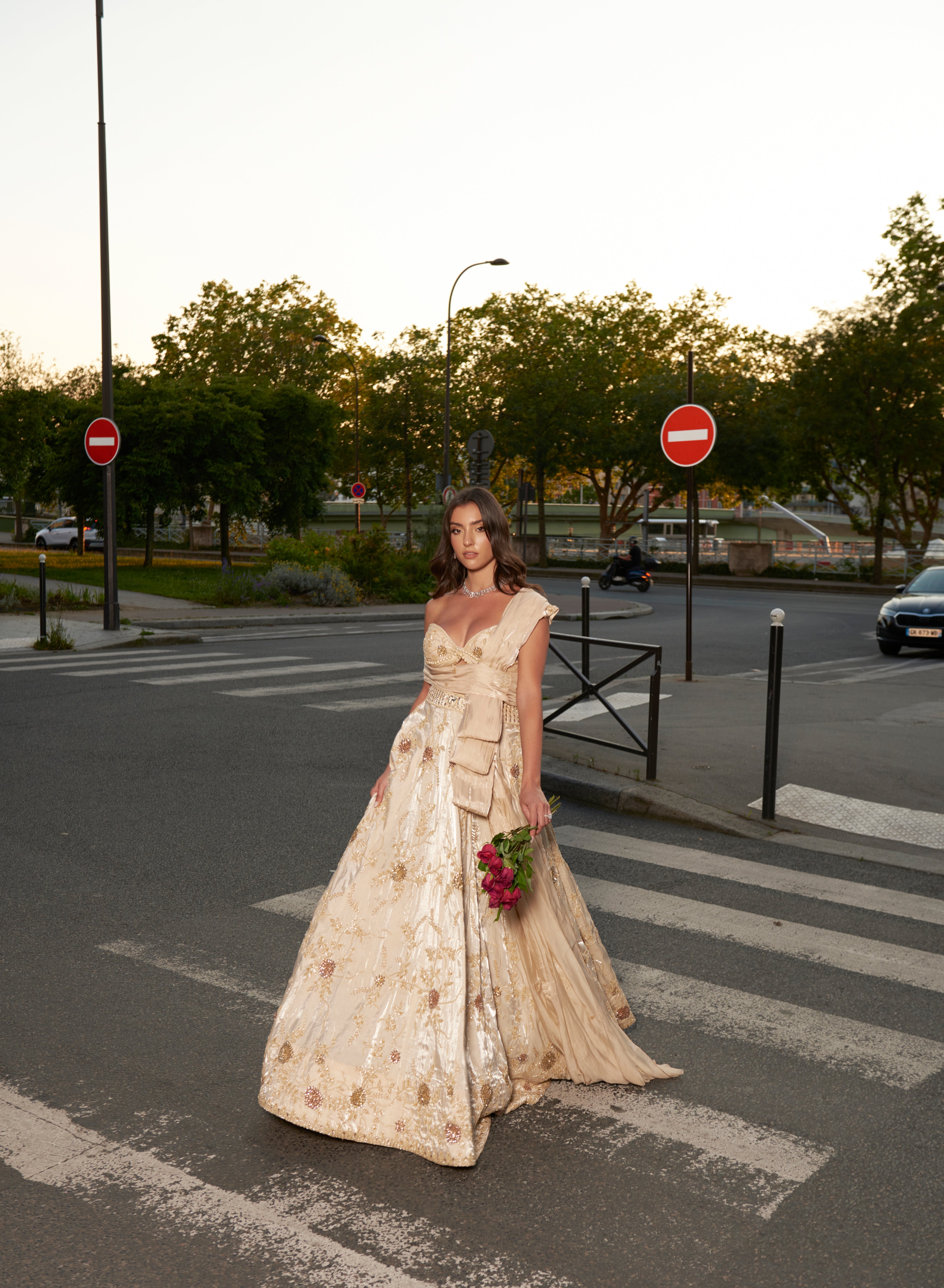 Butterscotch ivory lehenga set with intricate hand embroidery, crafted from glass organza. Includes a pre-draped dupatta for a seamless and elegant look, ideal for weddings and celebrations.