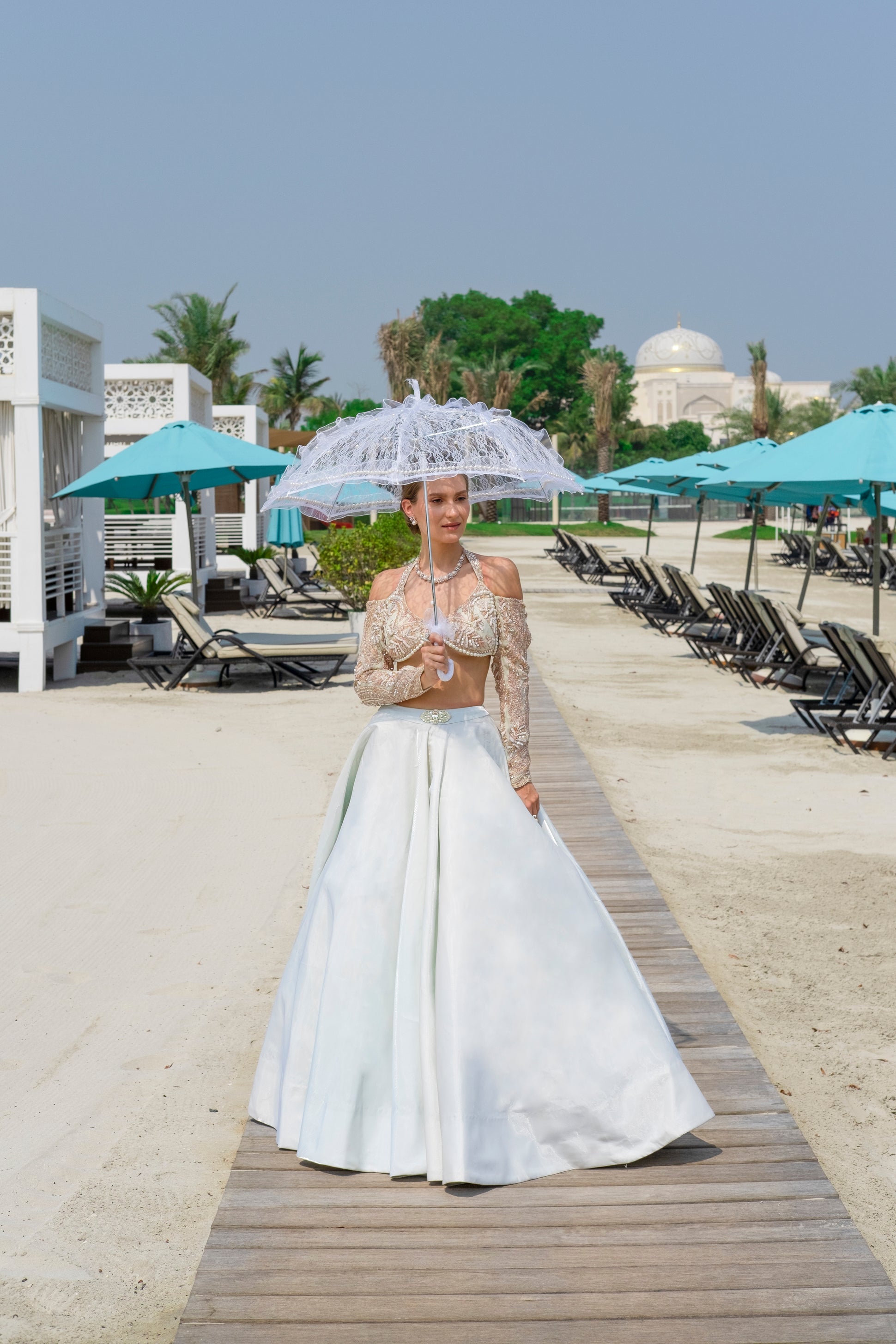 Spring Mint organza lehenga with a luminous flow, paired with a hand-embroidered full-sleeved blouse and a delicate net dupatta