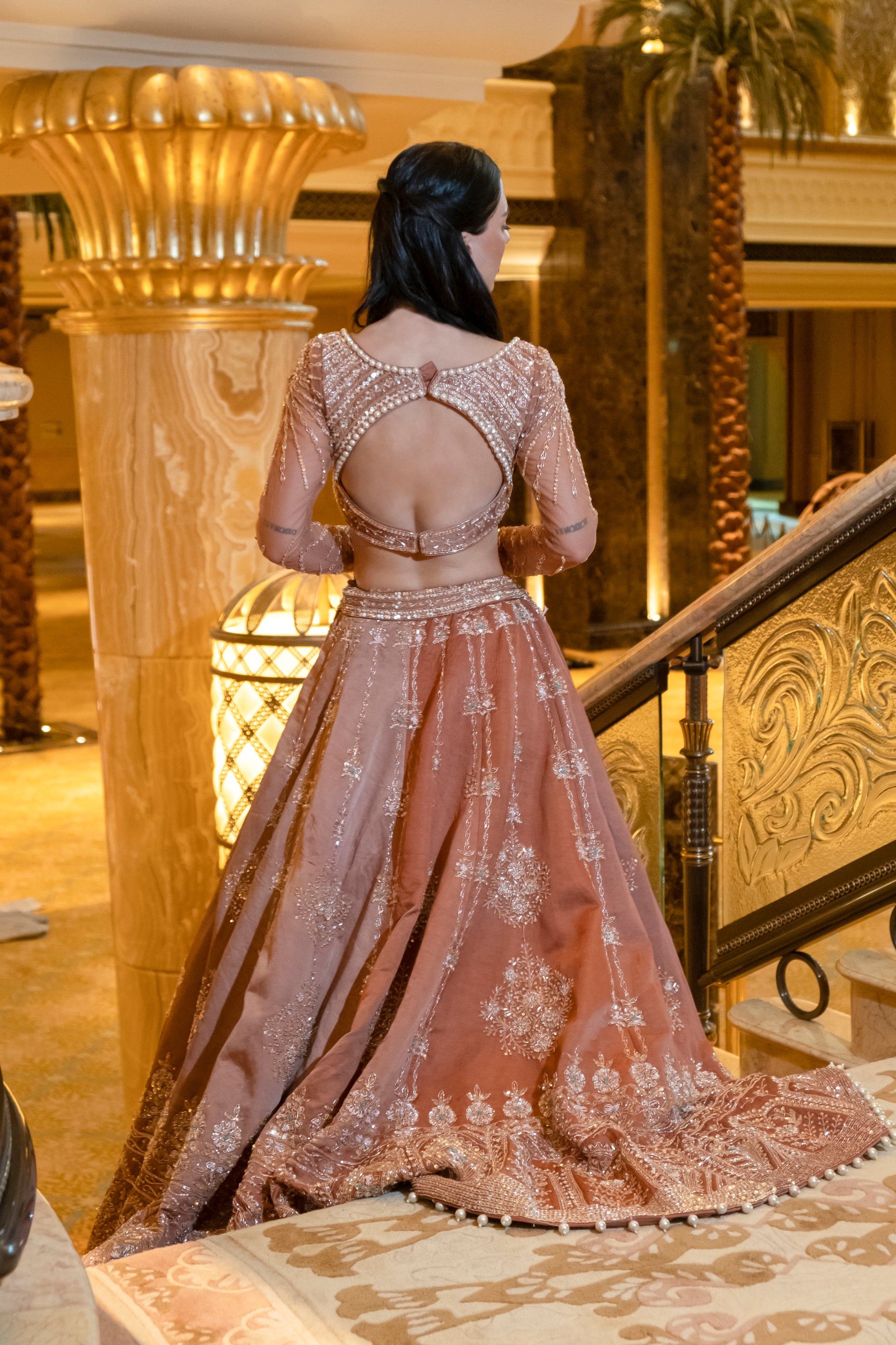 Earthy brown Habutai silk lehenga set with delicate handwork on net sleeves and a flowing net dupatta for a refined look